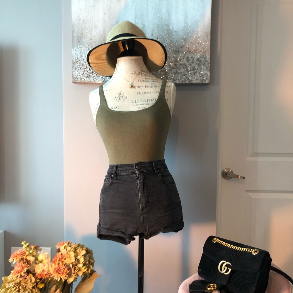 Olive bodysuit and black denim shorts